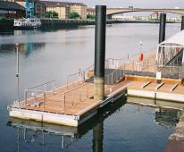 Think they put in the upright poles, then the pontoons attached with D rings so they raise and lower with tides.